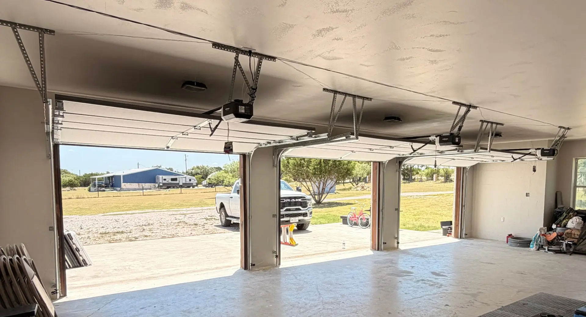 Three 9 by 7 garage doors interior installation view