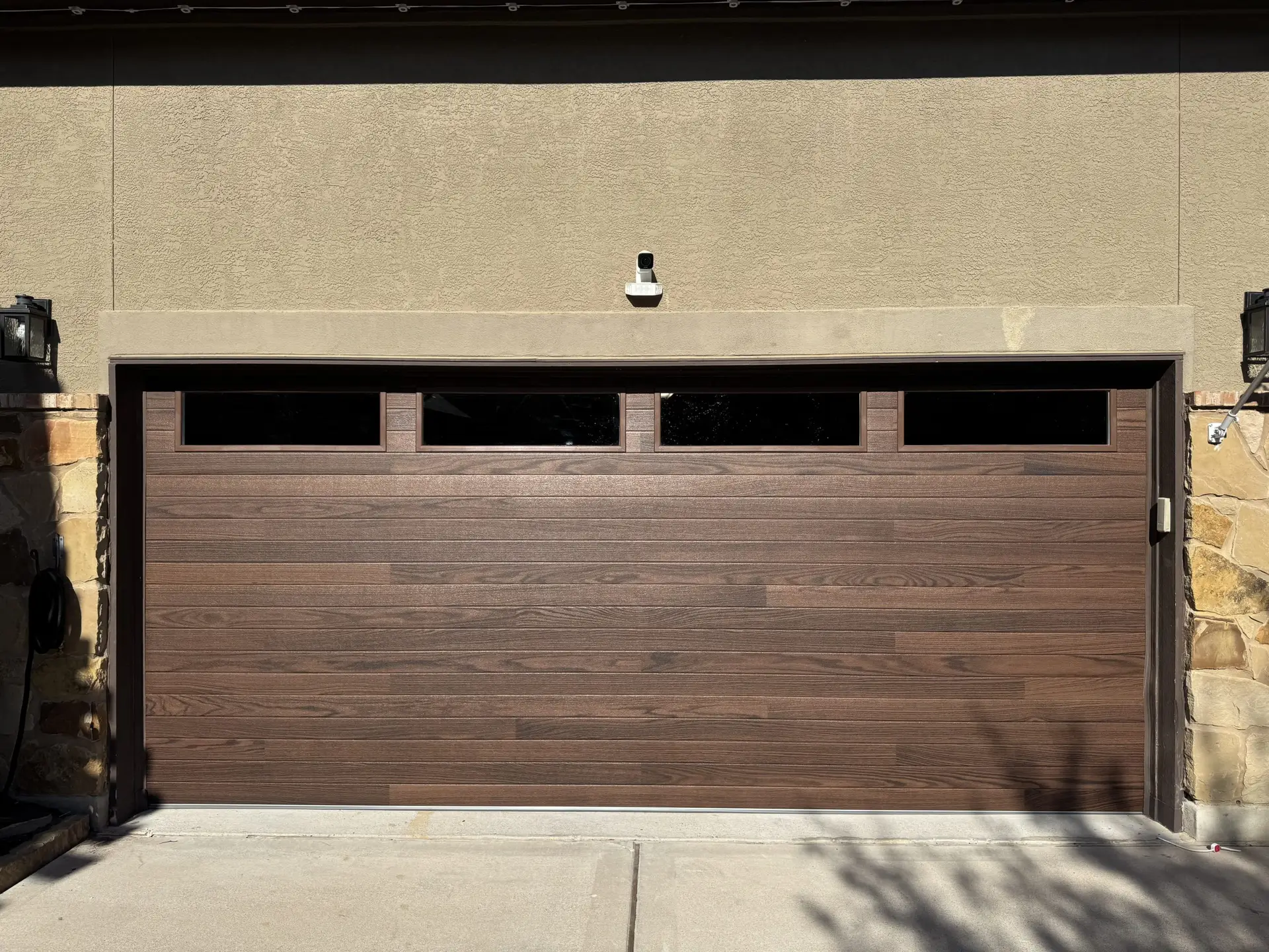 Plank oak style residential garage door